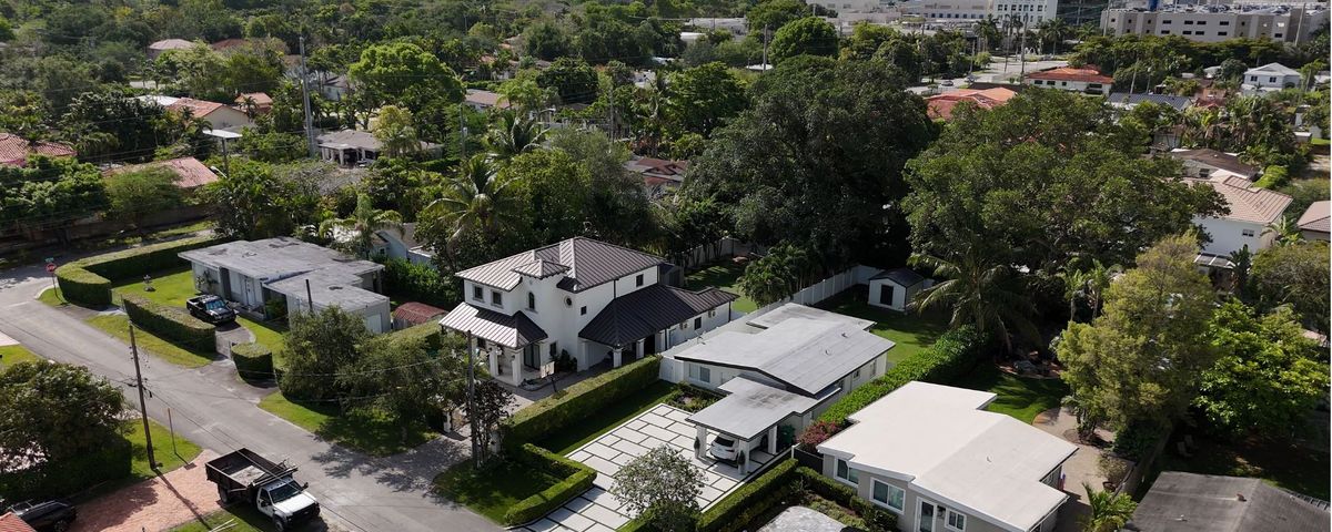 Aerial view of a single-family home with driveway in Schenley Park, Miami FL 33155